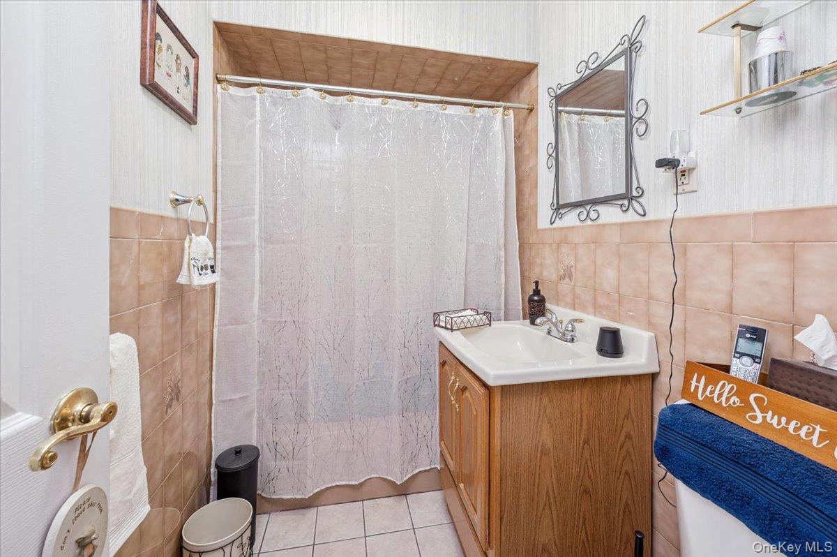 1007 Sacket Avenue Bronx, NY 10462 - Photo 16 of 29 a bathroom with a sink toilet and shower