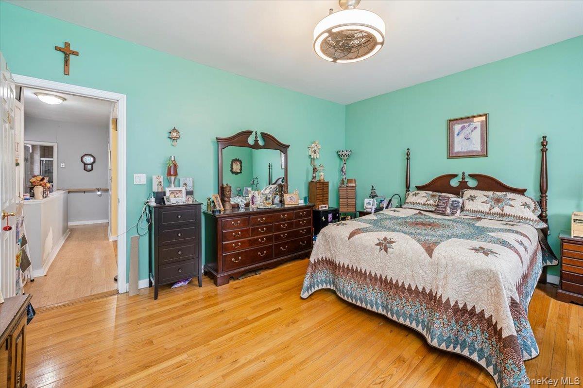 1007 Sacket Avenue Bronx, NY 10462 - Photo 20 of 29 a bedroom with a bed and a dresser