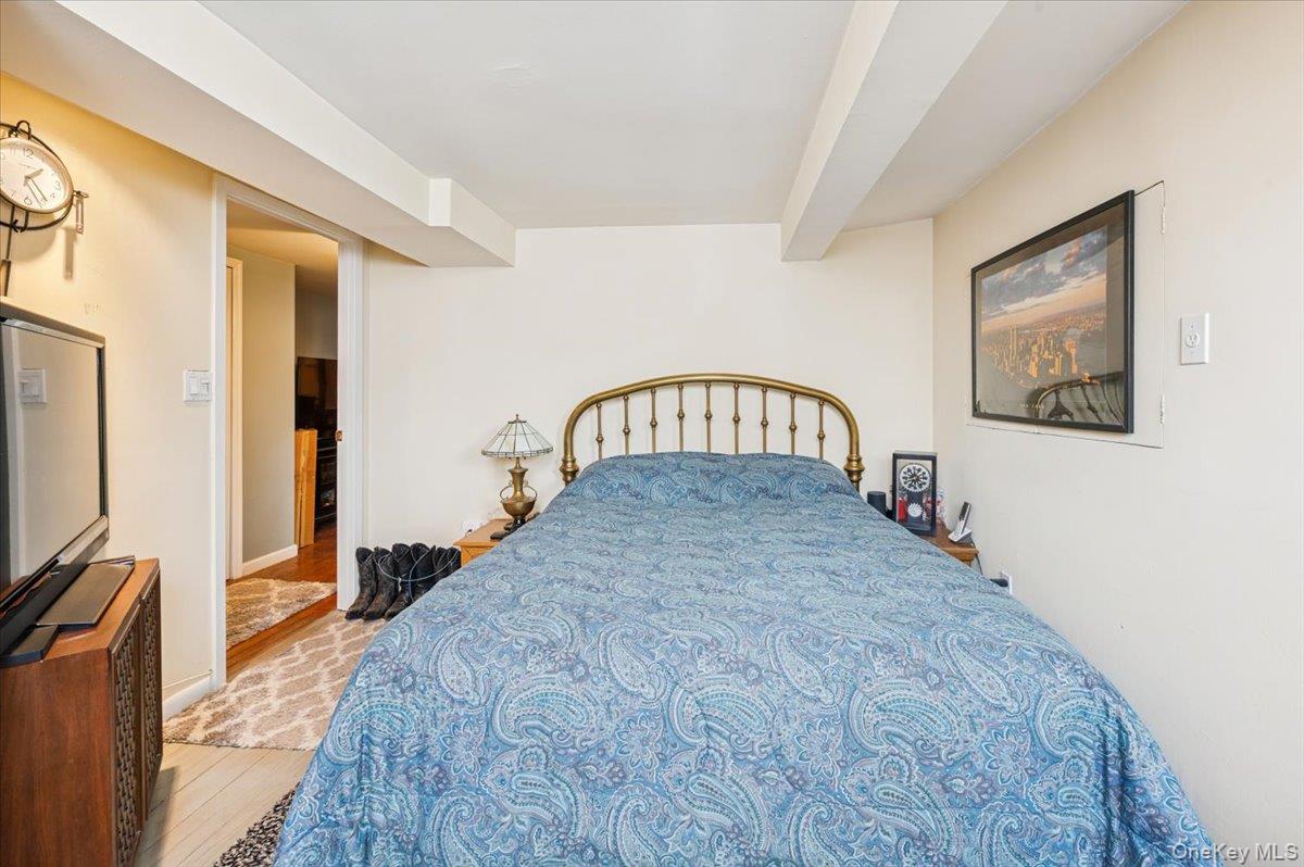 1007 Sacket Avenue Bronx, NY 10462 - Photo 23 of 29 a bedroom with a bed and a flat screen tv