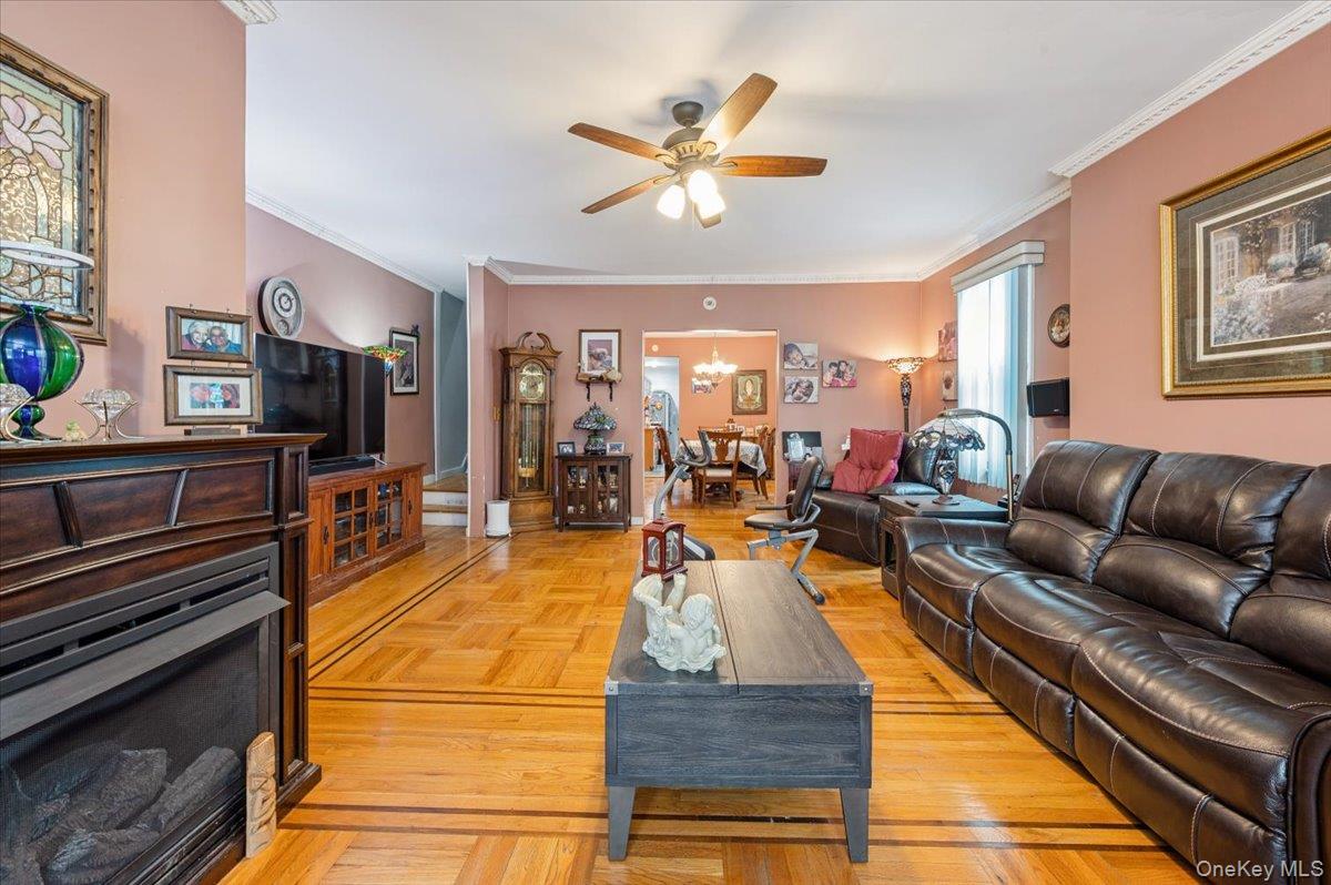 1007 Sacket Avenue Bronx, NY 10462 - Photo 5 of 29 a living room with furniture and a flat screen tv
