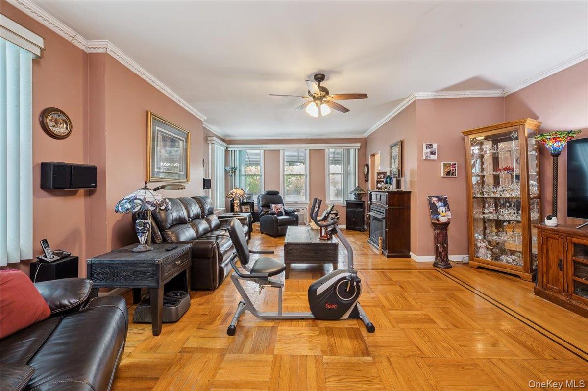 1007 Sacket Avenue Bronx, NY 10462 - Photo 6 of 29 a living room with lots of furniture and a flat screen tv