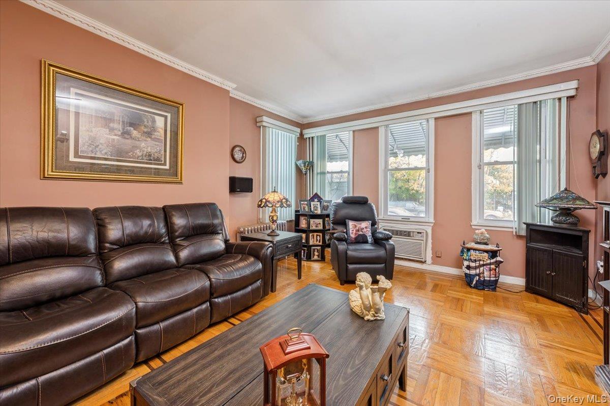 1007 Sacket Avenue Bronx, NY 10462 - Photo 7 of 29 a living room with furniture large window and wooden floor