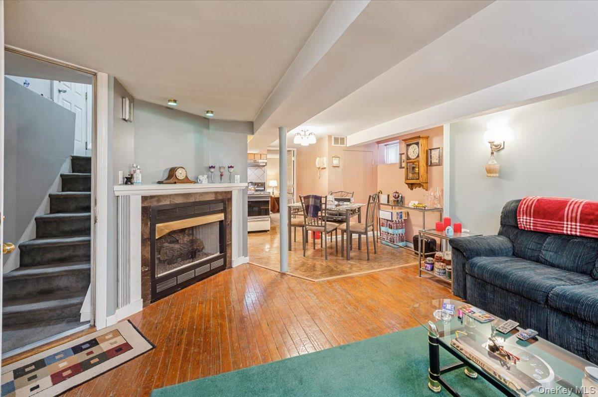 1007 Sacket Avenue Bronx, NY 10462 - Photo 9 of 29 a living room with furniture and wooden floor