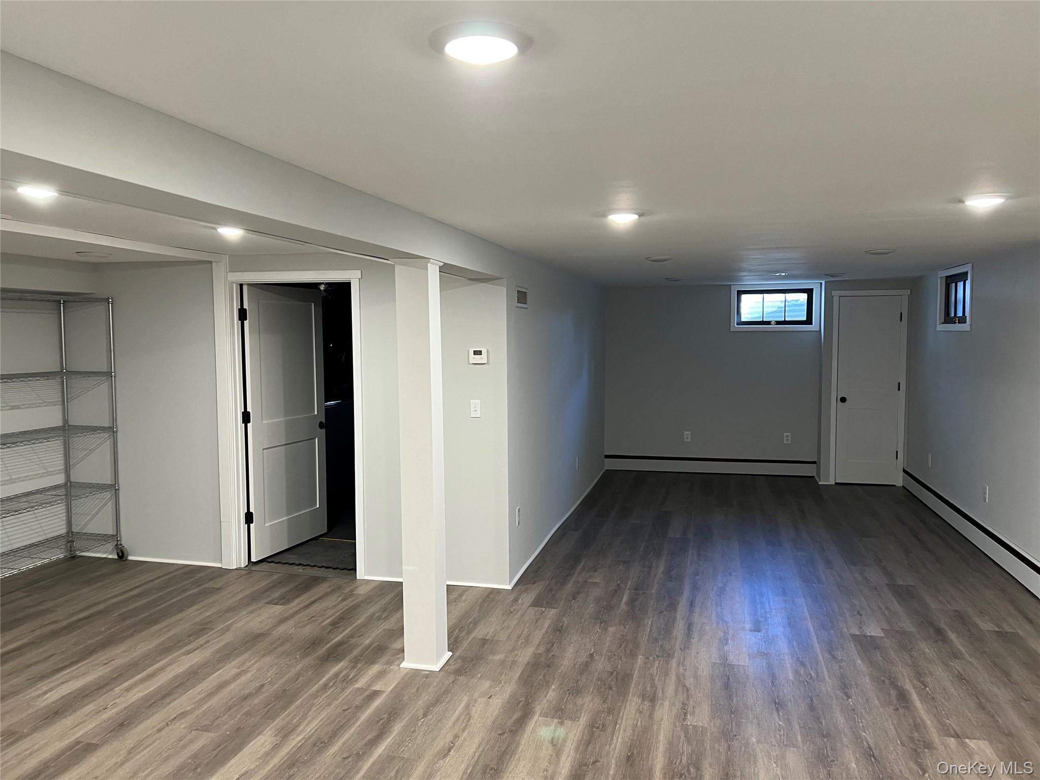 27 Lakeview Road Carmel, NY 10512 - Photo 11 of 11 an empty room with wooden floor and windows