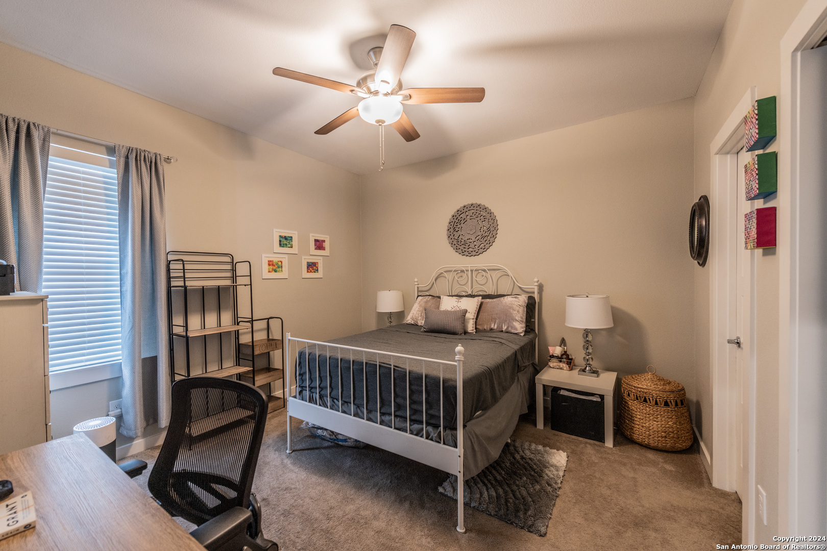 619 Burleson San Antonio, TX 78202 - Photo 12 of 21 a bedroom with a bed and a chandelier