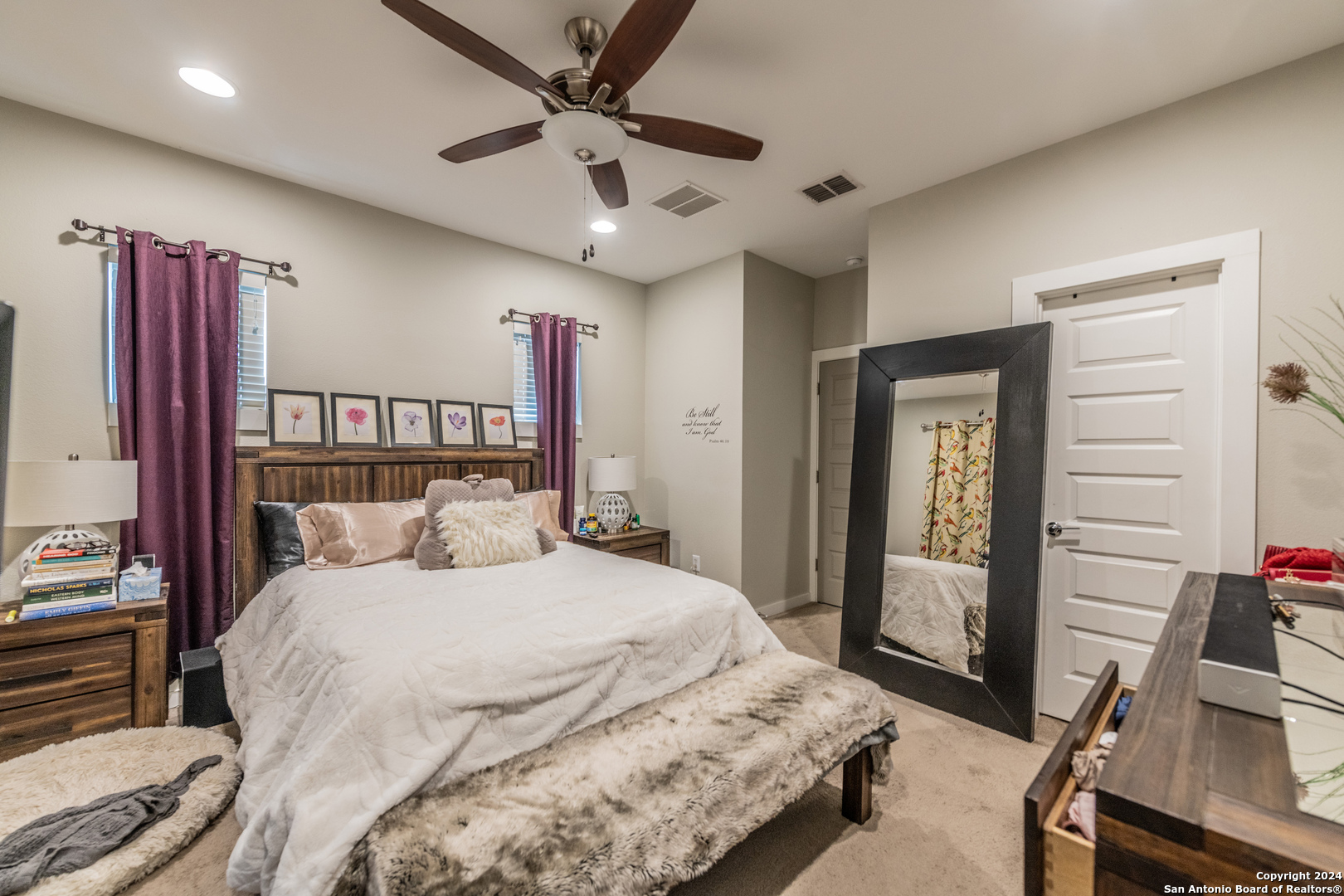 619 Burleson San Antonio, TX 78202 - Photo 16 of 21 a bedroom with a large bed and a chandelier