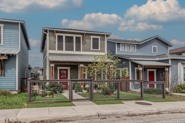 a view of a brick building next to a yard