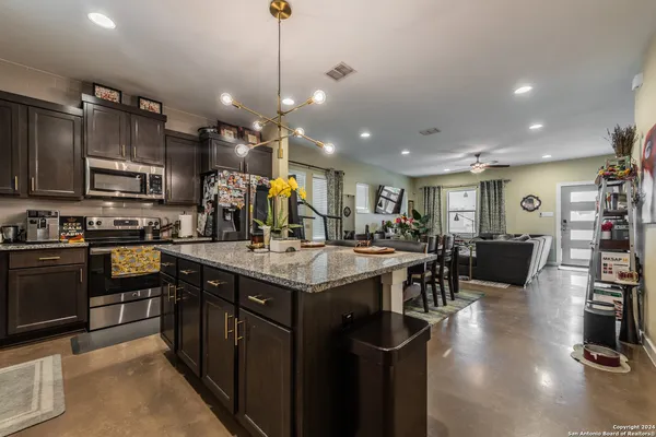 a kitchen with a counter space cabinets and appliances