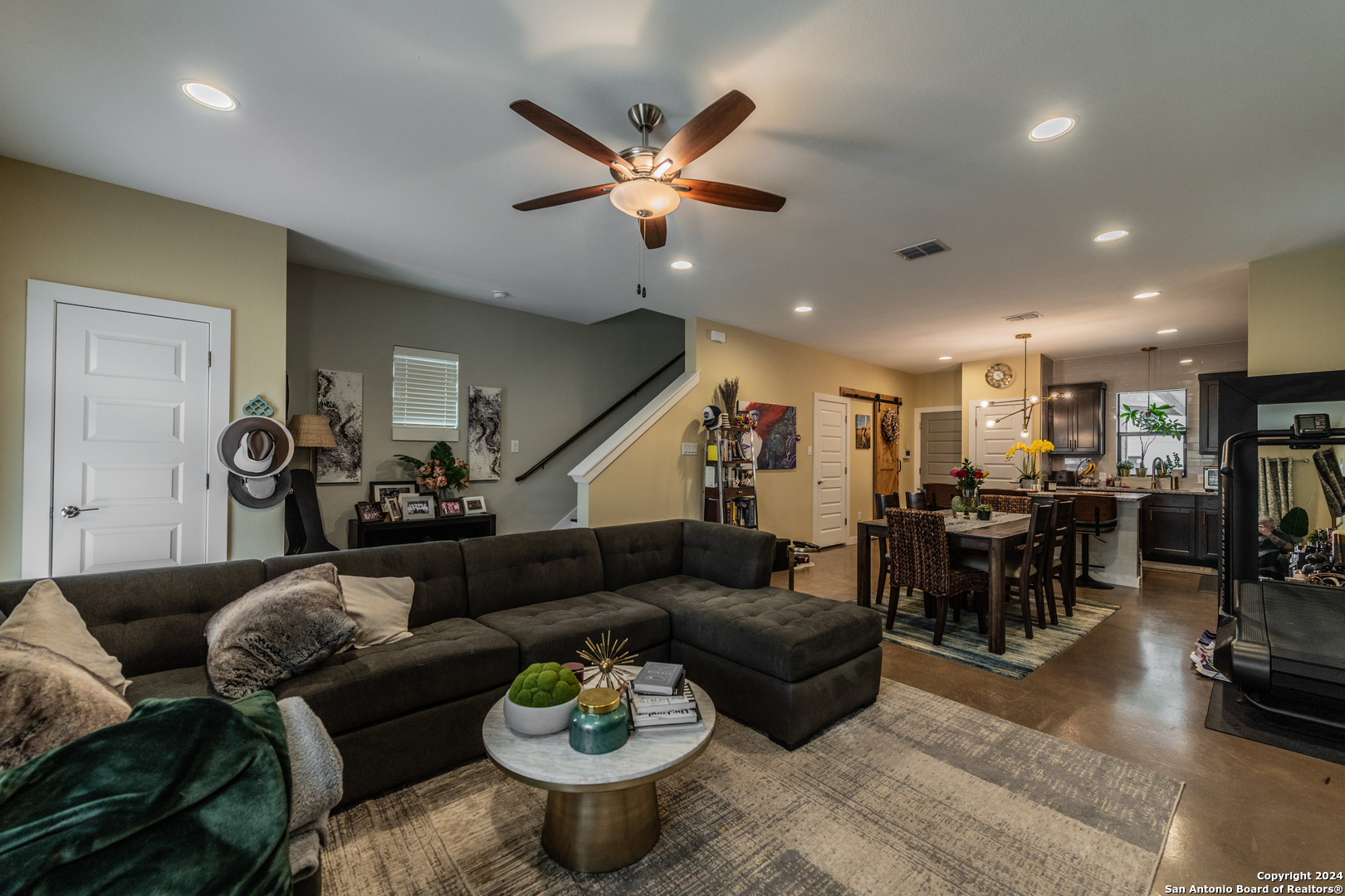 619 Burleson San Antonio, TX 78202 - Photo 7 of 21 a living room with furniture kitchen view and a chandelier
