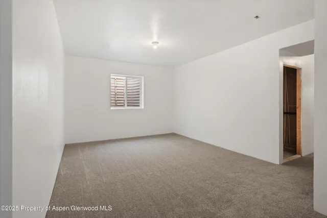 an empty room with a empty space and window