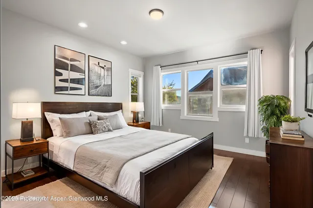 a bedroom with a large bed and a window