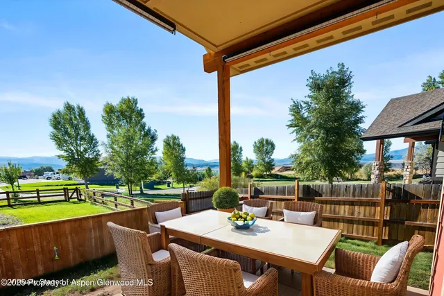 a kitchen with cabinets stainless steel appliances and a refrigerator