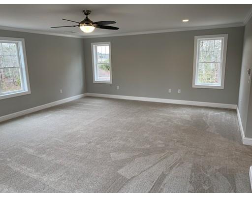 107 County Road Freetown, MA 02717 - Photo 13 of 32 an empty room with windows and chandelier fan