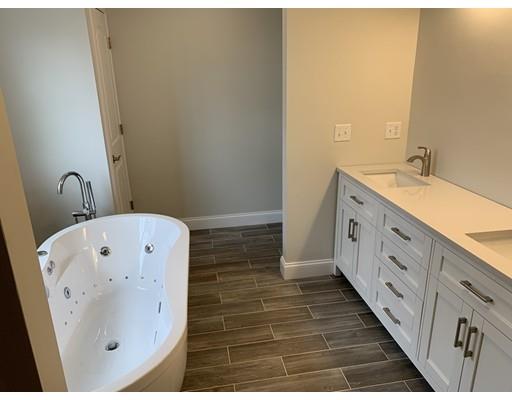 107 County Road Freetown, MA 02717 - Photo 18 of 32 a bathroom with a double vanity sink and mirror