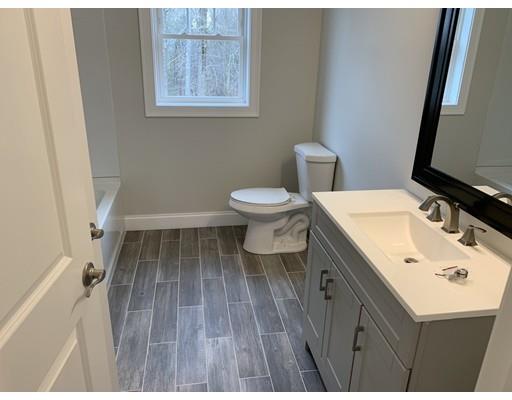 107 County Road Freetown, MA 02717 - Photo 21 of 32 a bathroom with a sink toilet and a mirror