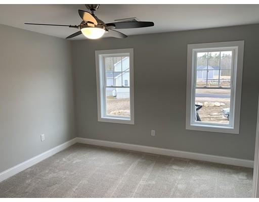 107 County Road Freetown, MA 02717 - Photo 25 of 32 an empty room with windows and fan