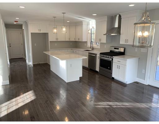107 County Road Freetown, MA 02717 - Photo 3 of 32 a large kitchen with stainless steel appliances kitchen island a large counter top and a wooden floors
