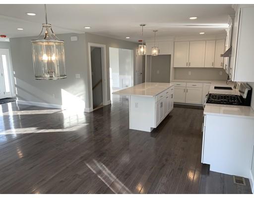 107 County Road Freetown, MA 02717 - Photo 4 of 32 a large kitchen with kitchen island white cabinets and stainless steel appliances