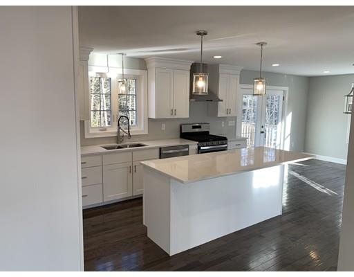 107 County Road Freetown, MA 02717 - Photo 6 of 32 a kitchen that has a lot of white cabinets and wooden floor