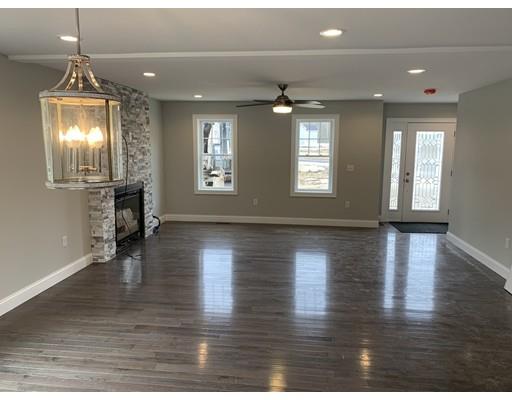 107 County Road Freetown, MA 02717 - Photo 8 of 32 an empty room with wooden floor and windows