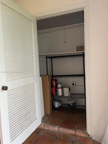 a view of an empty walk in closet