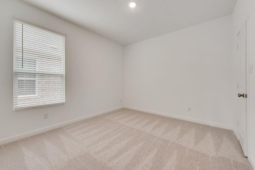 3009 Dutch Road Providence Village, TX 76227 - Photo 14 of 19 an empty room with a window