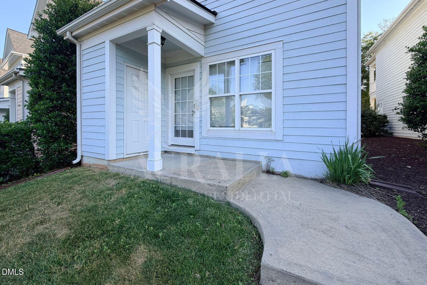 7754 ACC Boulevard Raleigh, NC 27617 - Photo 39 of 41 a front view of a house with garden