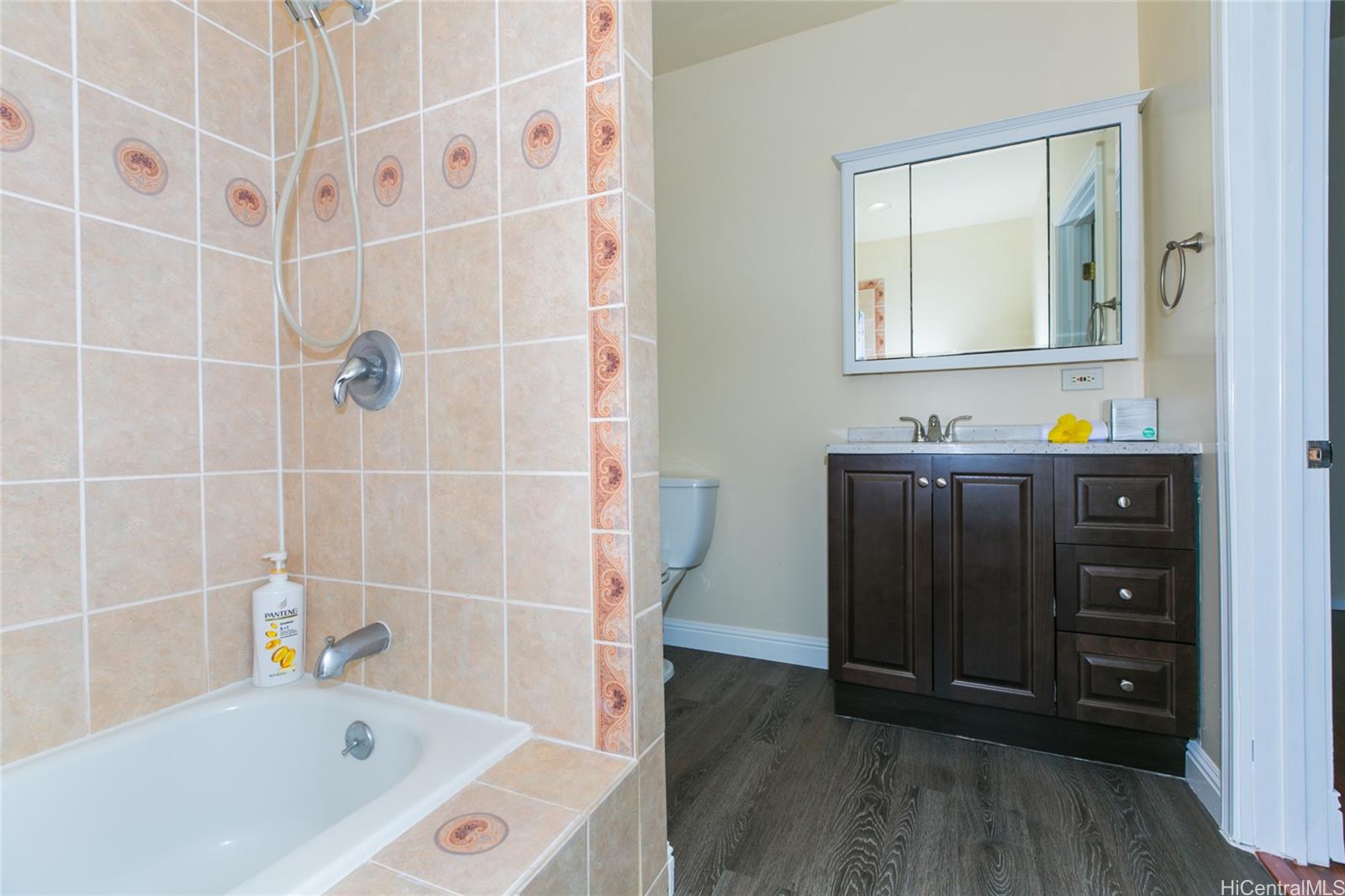 3741 Harding Avenue Honolulu, HI 96816 - Photo 14 of 24 a bathroom with a bathtub and a sink