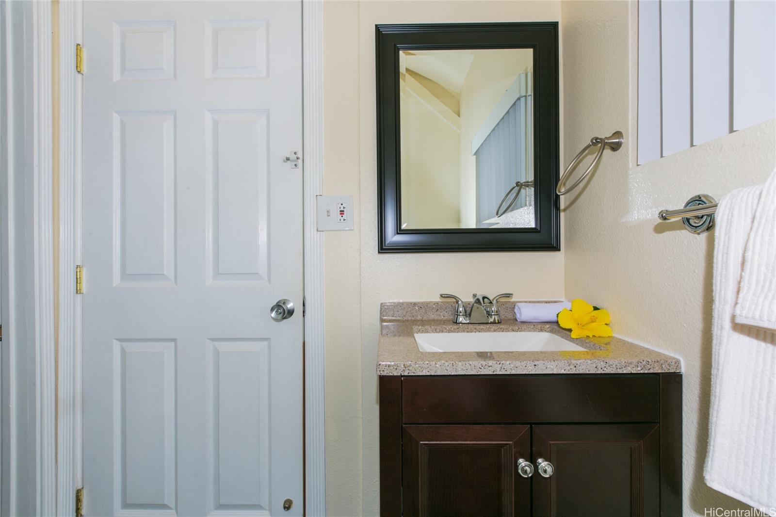 3741 Harding Avenue Honolulu, HI 96816 - Photo 18 of 24 a bathroom with a sink vanity and a mirror