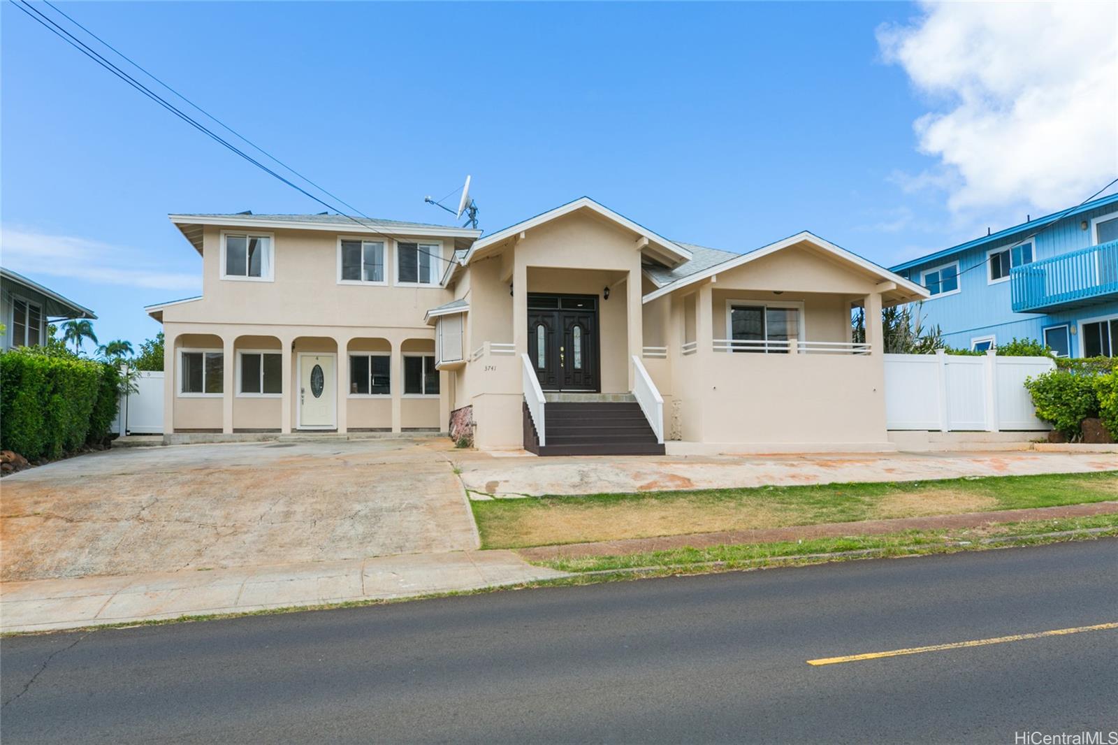 3741 Harding Avenue Honolulu, HI 96816 - Photo 2 of 24 a front view of a house with a garden and yard