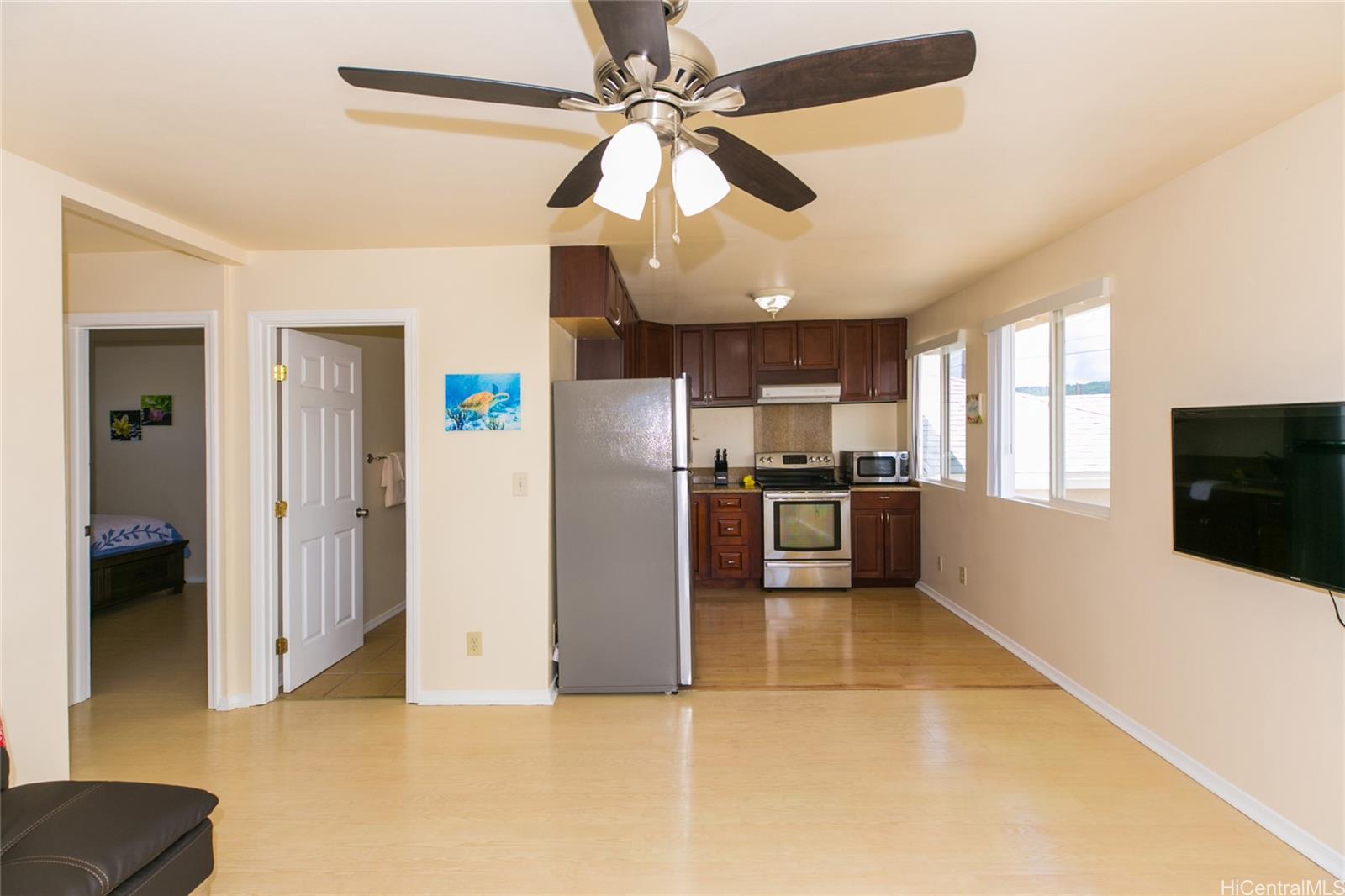 3741 Harding Avenue Honolulu, HI 96816 - Photo 22 of 24 a view of a kitchen with a stove cabinets and a ceiling fan