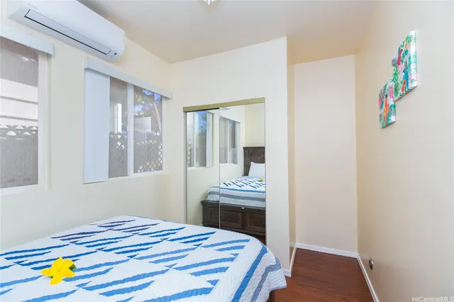 a bedroom with a bed and a table in it