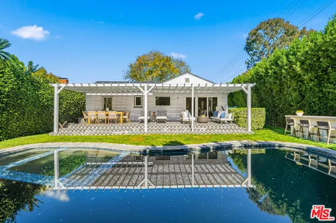 a view of swimming pool with seating space
