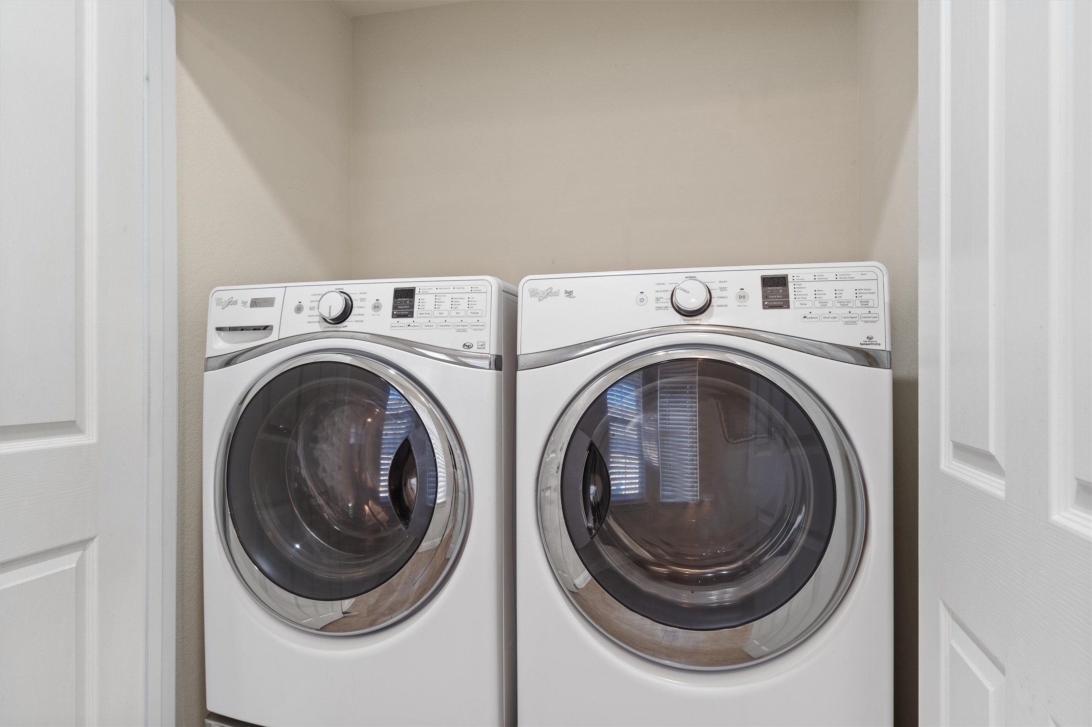 307 Kickapoo Creek Lane Georgetown, TX 78633 - Photo 11 of 30 An organized laundry closet features modern side-by-side appliances and bi-fold doors.