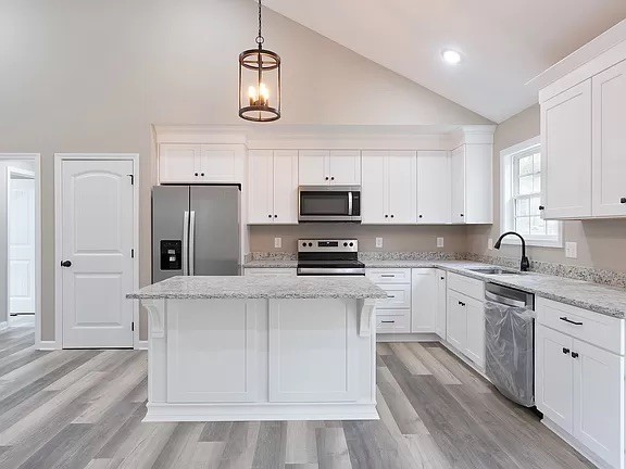 1364 Lecomte Road Dickson, TN 37055 - Photo 2 of 4 a kitchen with white cabinets and stainless steel appliances