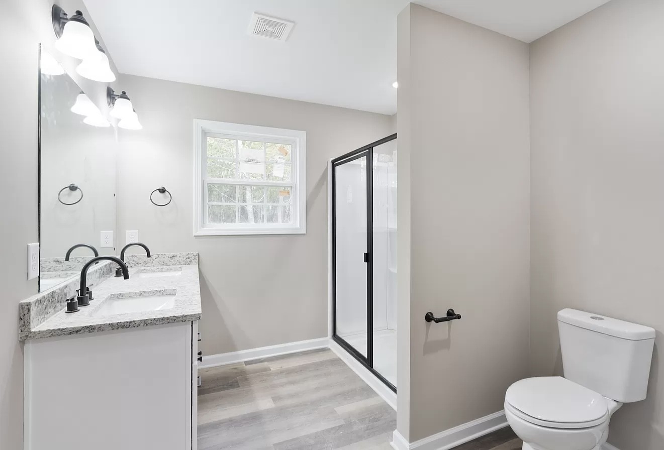 1364 Lecomte Road Dickson, TN 37055 - Photo 3 of 4 a bathroom with a sink toilet and shower