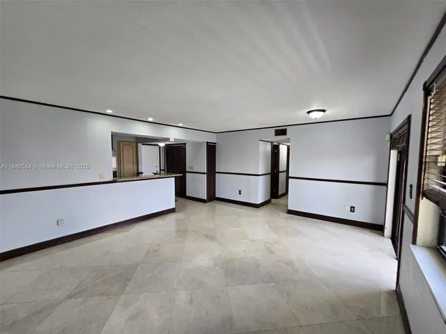 a view of an empty room with racks on the wall