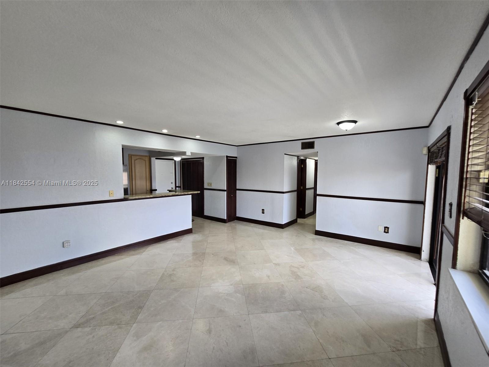 a view of an empty room with racks on the wall