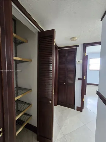 a view of an empty walk in closet