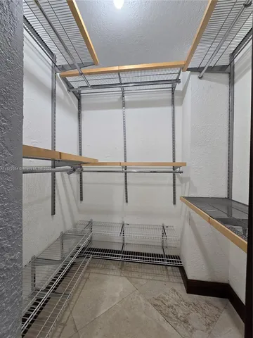 a view of a room with racks on the wall