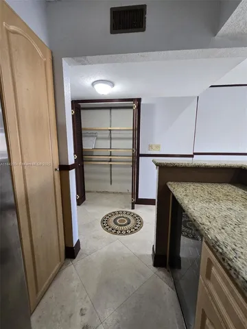 a kitchen with a sink a stove and refrigerator