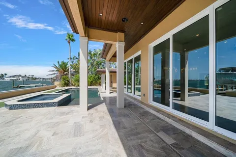 a large kitchen with granite countertop a large counter top and sink