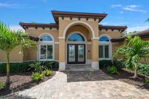 a kitchen with a sink and chandelier