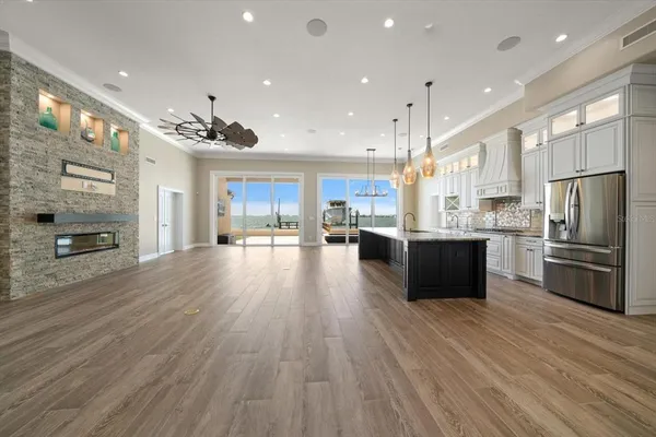 a kitchen with stainless steel appliances white cabinets and a stove