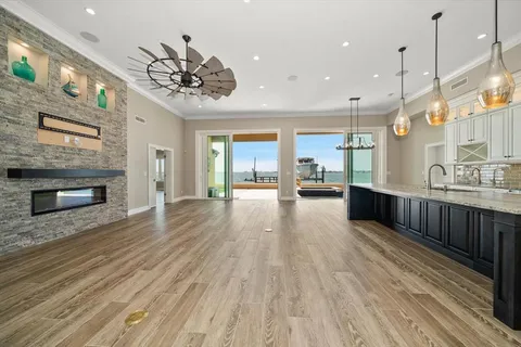 a bathroom with a granite countertop sink a toilet and bathtub