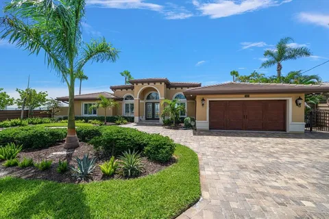 a view of a house with swimming pool having outdoor seating