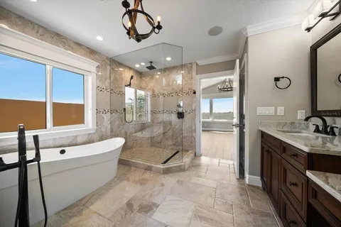 a spacious bathroom with a double vanity sink a large mirror and shower