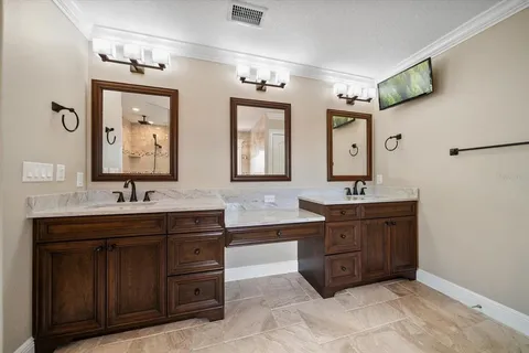 a kitchen with cabinets and stainless steel appliances