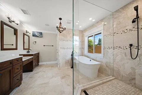 a white bath tub sitting next to a white toilet and sink