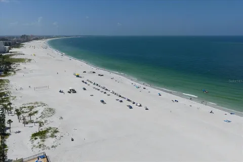 a view of swimming pool with outdoor seating and city view
